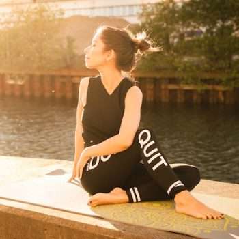 woman doing yoga: caring for your fitness journey