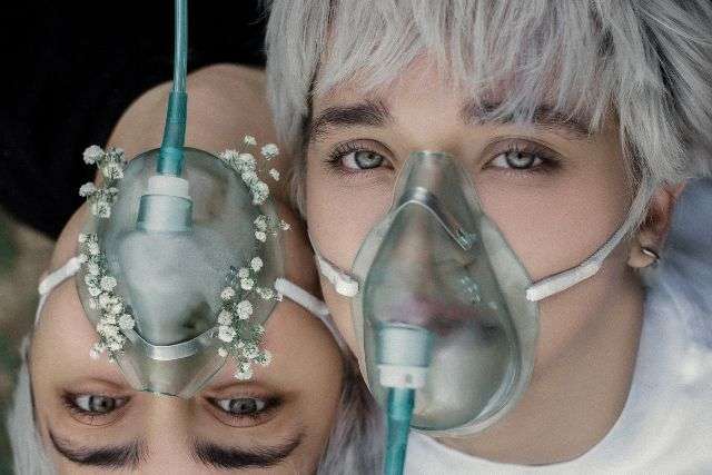 portable oxygen concentrator: women wearing oxygen masks