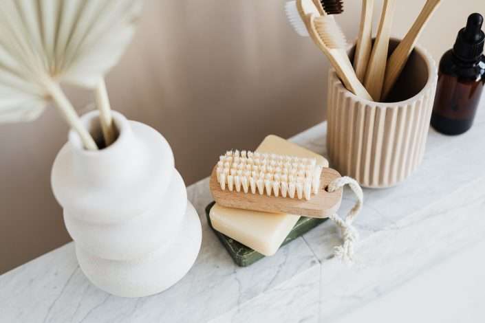 set of natural toiletries on marble counter