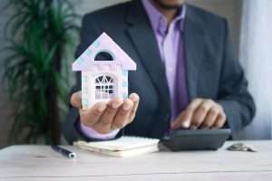 skyrocket your property value: realtor holding model home