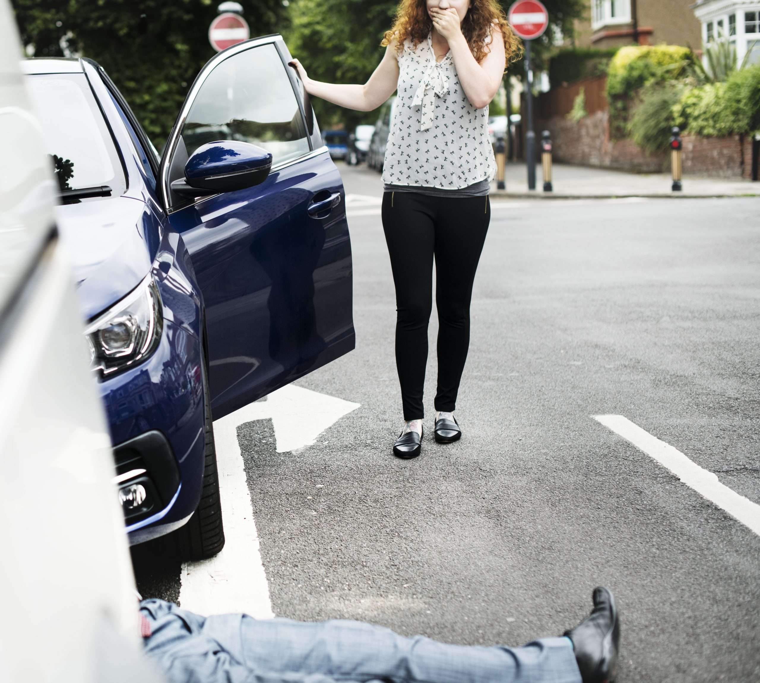Pedestrian Accident - Person lying on the ground after a car accident