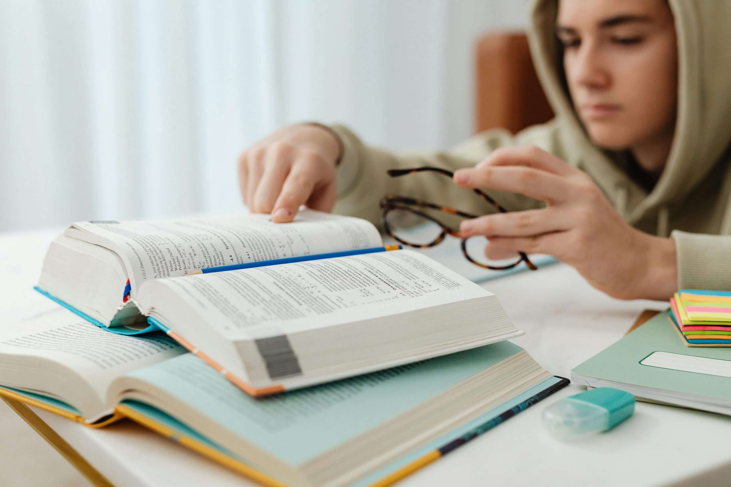 man tired of reading books in a revision space