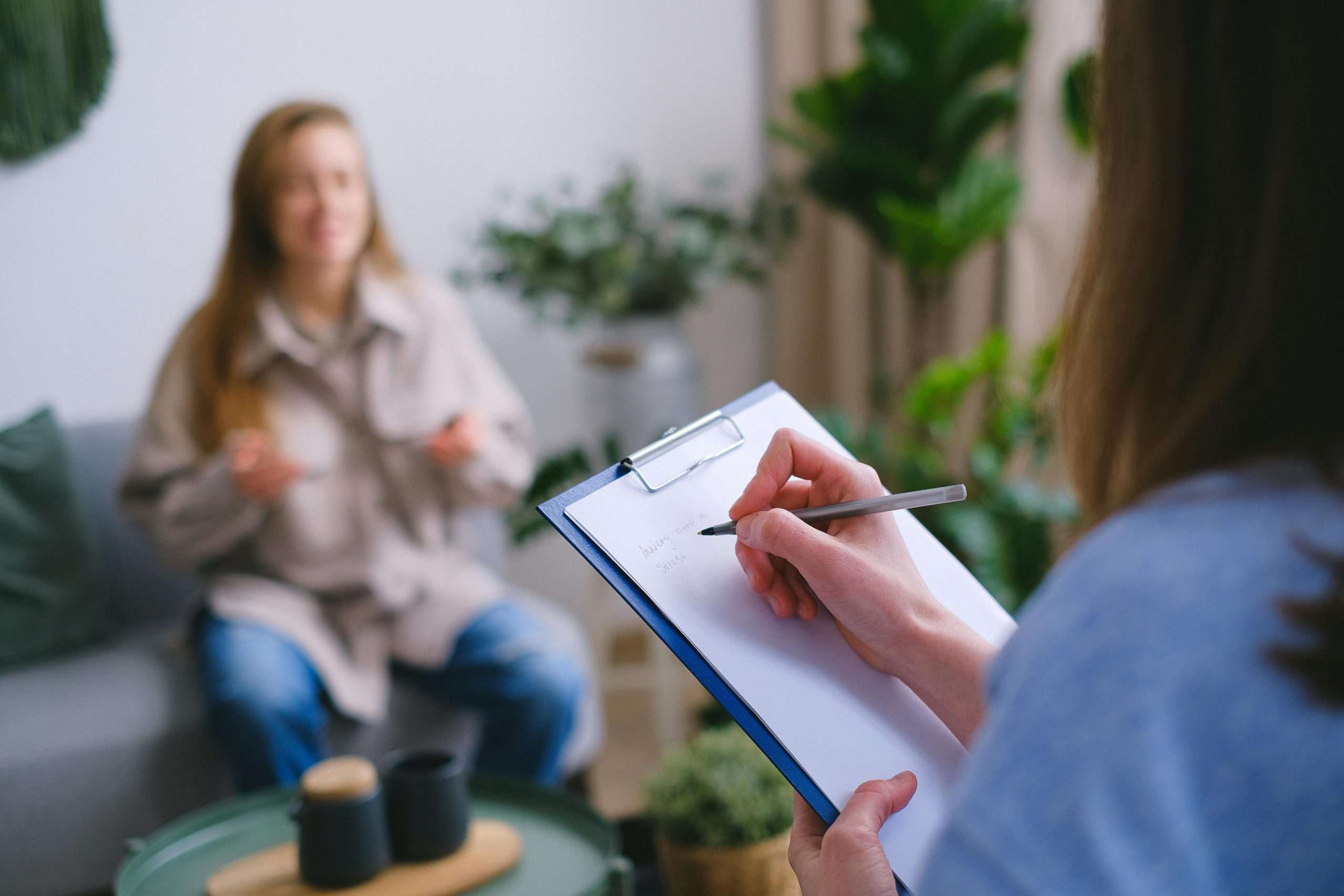 psychologist taking notes good mental health