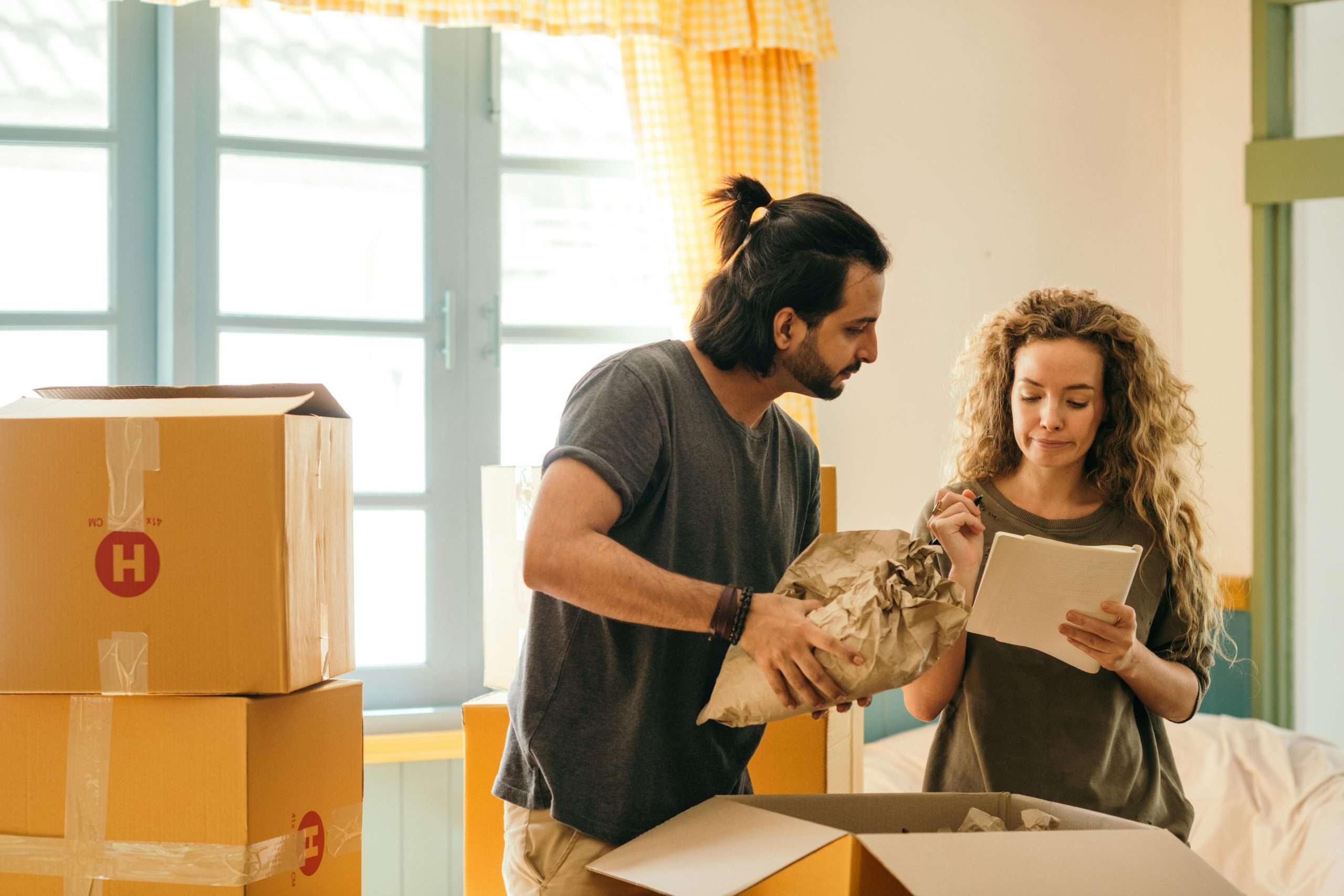 couple unpacking their new home