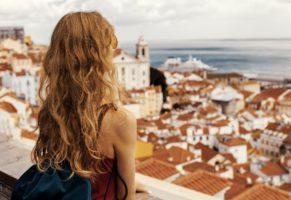 Girl looking at a city from above