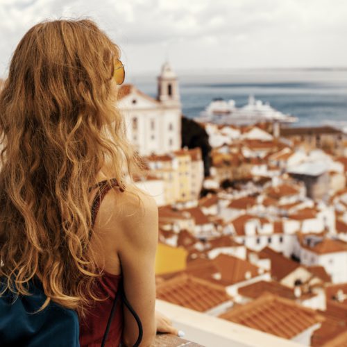 Girl looking at a city from above