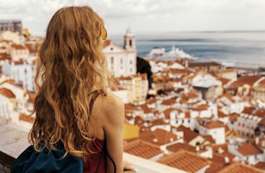 Girl looking at a city from above