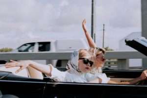 road trip - women in a convertible