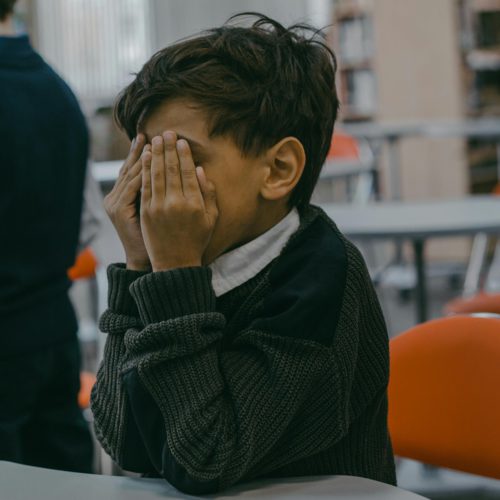 child abuse defense - child covering his face
