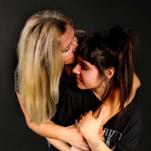 anxiety - woman kissing girls forehead