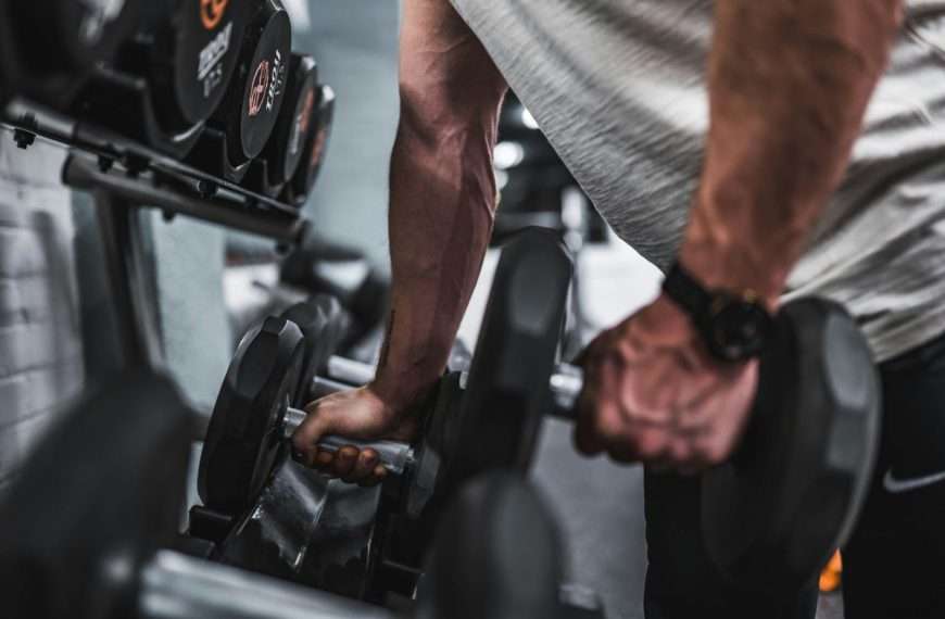 workout - man lifting dumbells