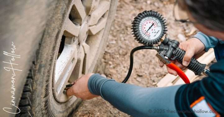 checking tire pressure before a road trip