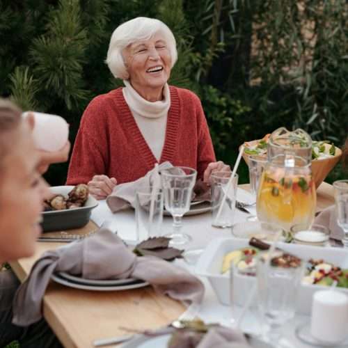 family enjoying dinner in the garden