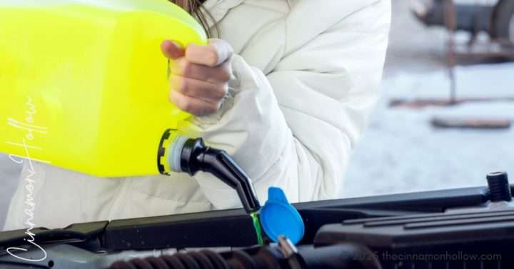 adding windshield washer fluid before a road trip