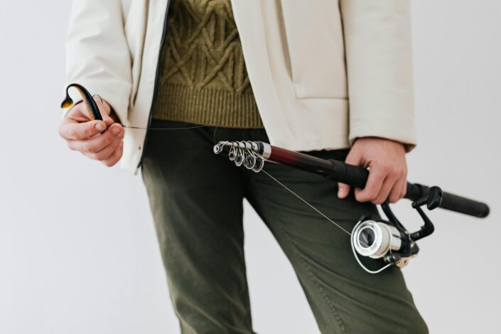 man holding a fishing pole