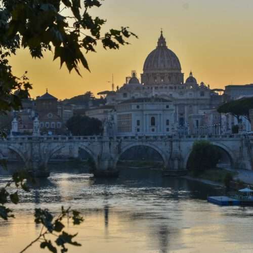 st. peter's basilica and ponte santangelo at sunset