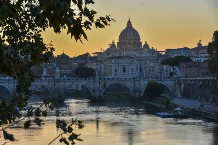st. peter's basilica and ponte santangelo at sunset