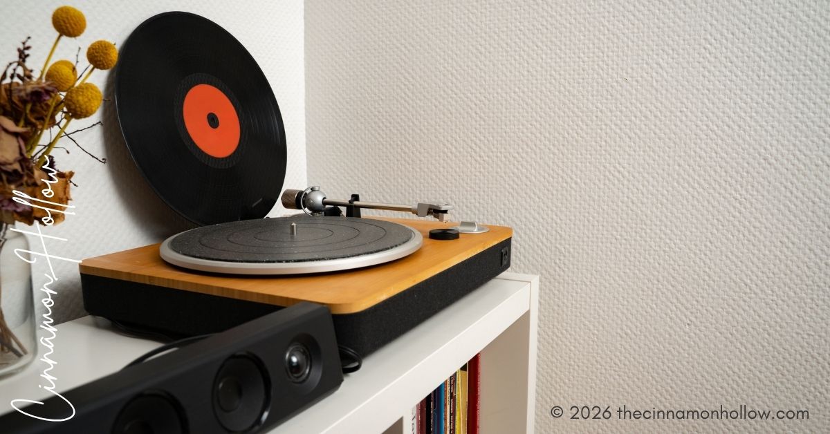 Vinyl record leaning against wall next to turntable