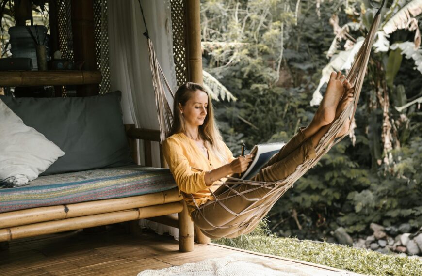 slow travel - woman relaxing in a hammock