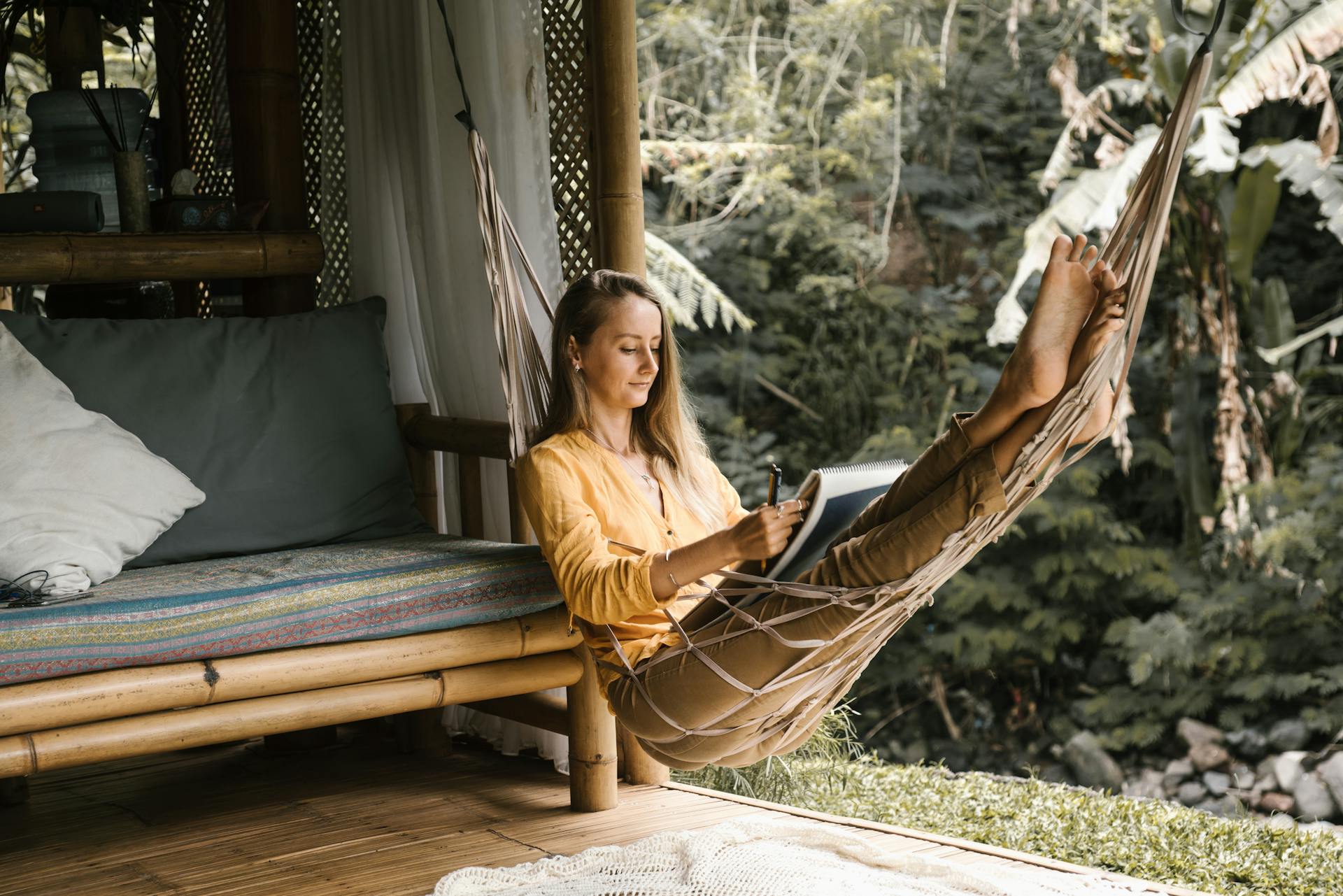 slow travel - woman relaxing in a hammock
