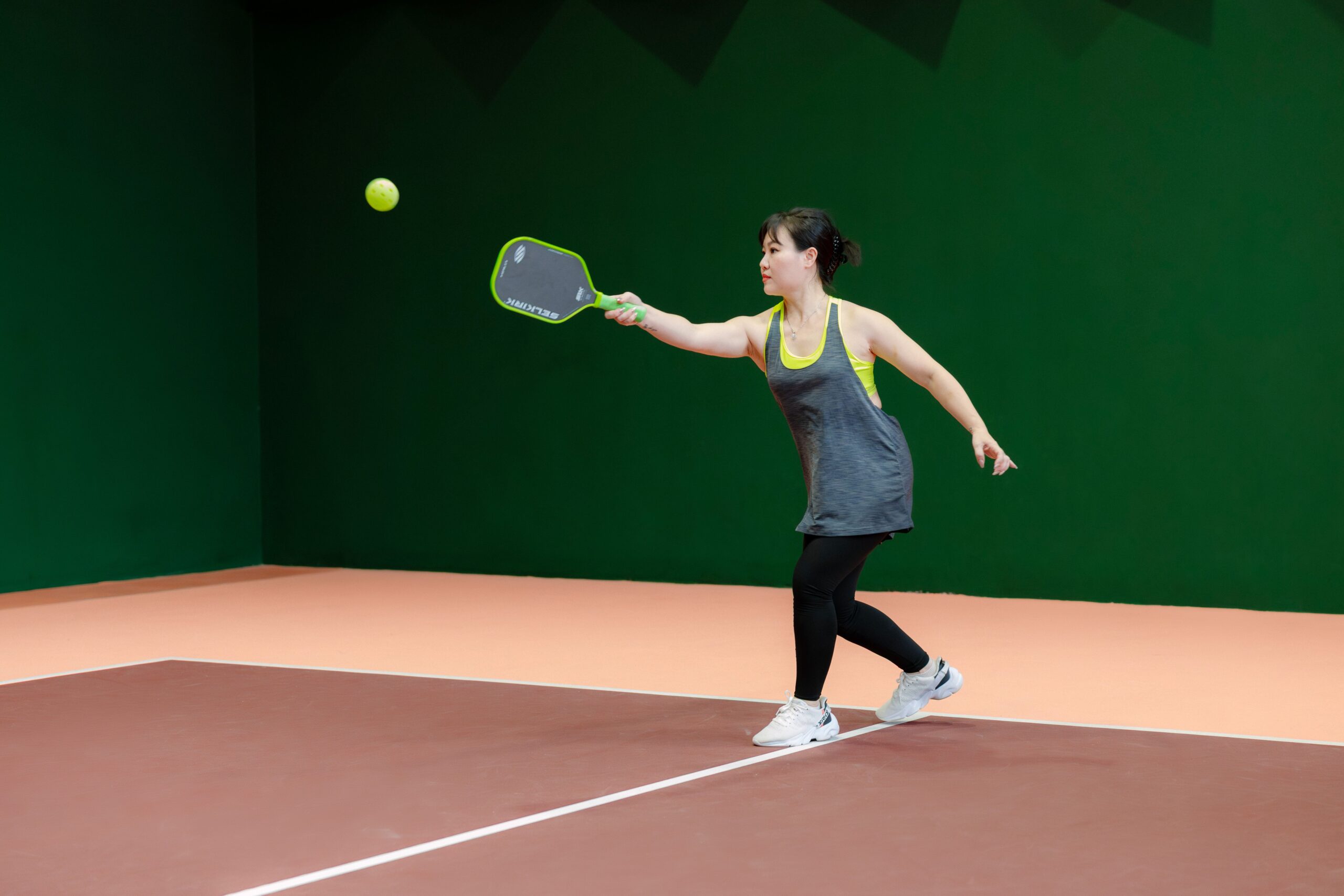 woman playing Pickleball - equipment - net