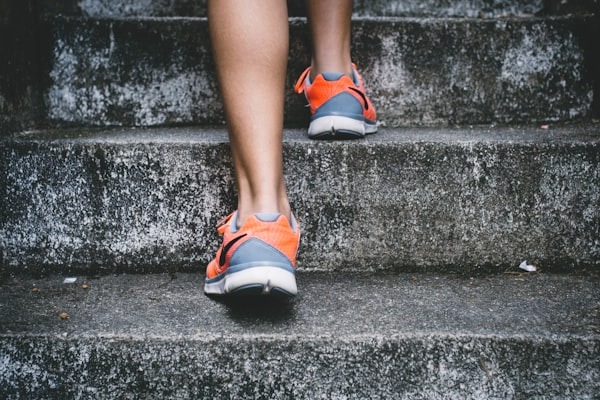 woman walking up stairs