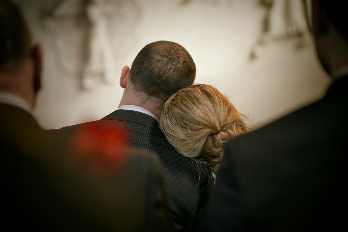 Funeral Packages - couple mourning at a funeral