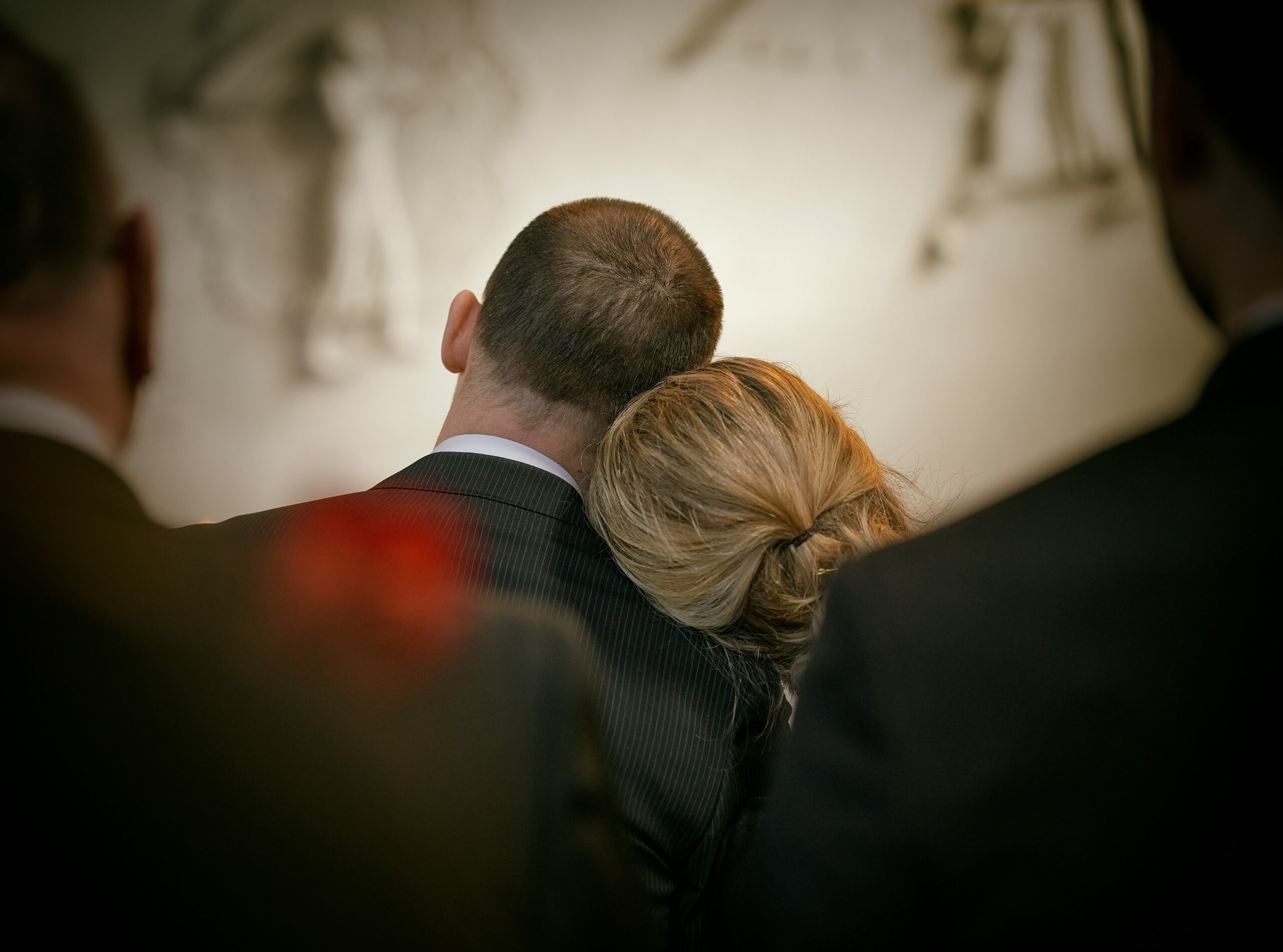Funeral Packages - couple mourning at a funeral