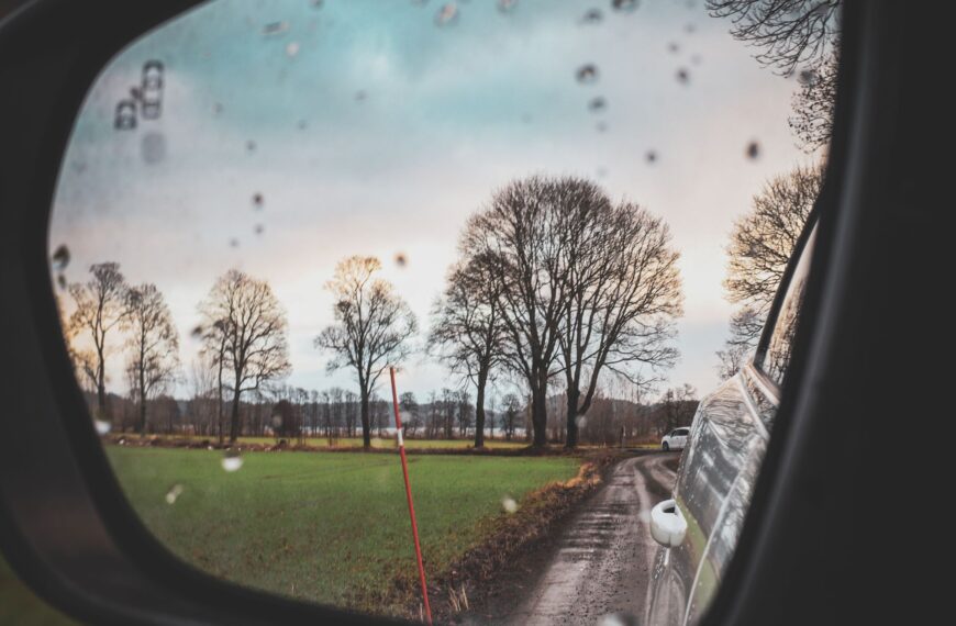 response after a car accident - rain on a car mirror