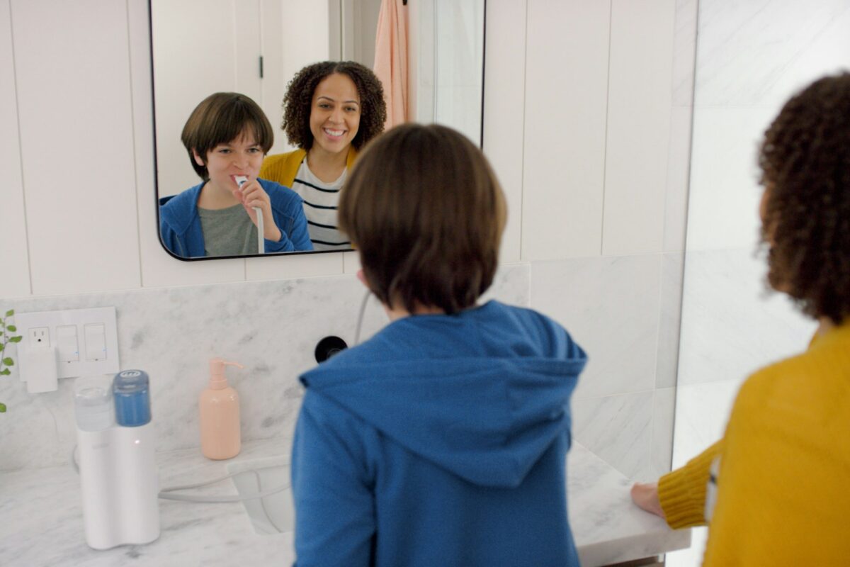 smile - a child brushing their teeth