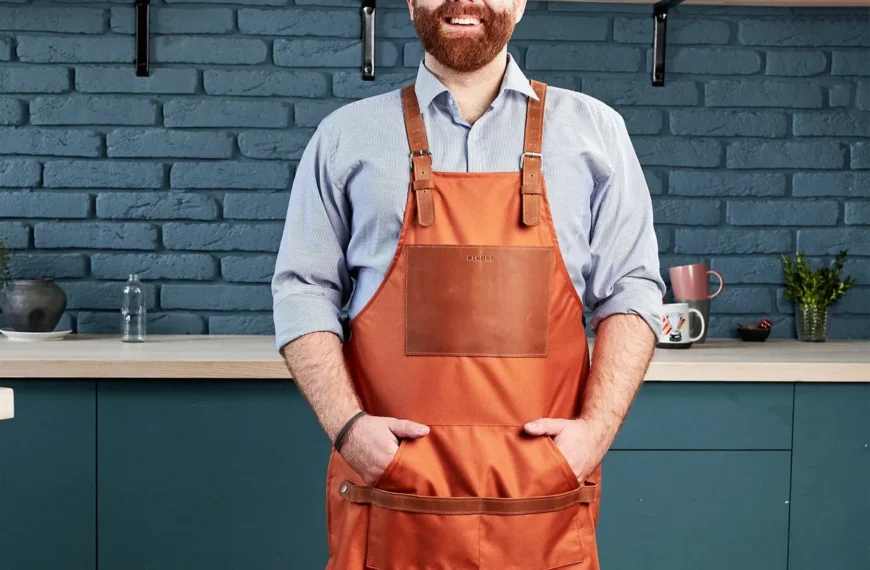 man standing in kitchen wearing a custom apron